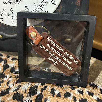 Remember… We are a Nice Normal Family Timber Key Tag